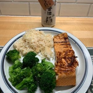 Grill Pan Ginger Salmon on a plate with broccoli and rice