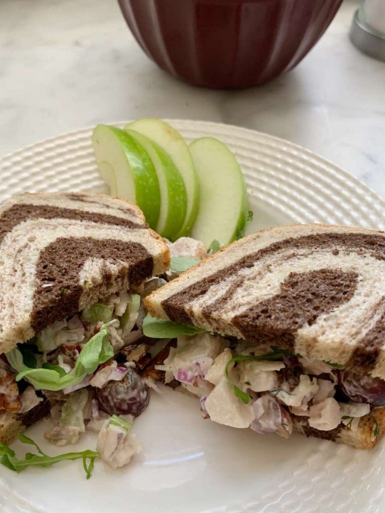 Leftover Roasted Turkey Salad sandwich with sliced apples on a plate