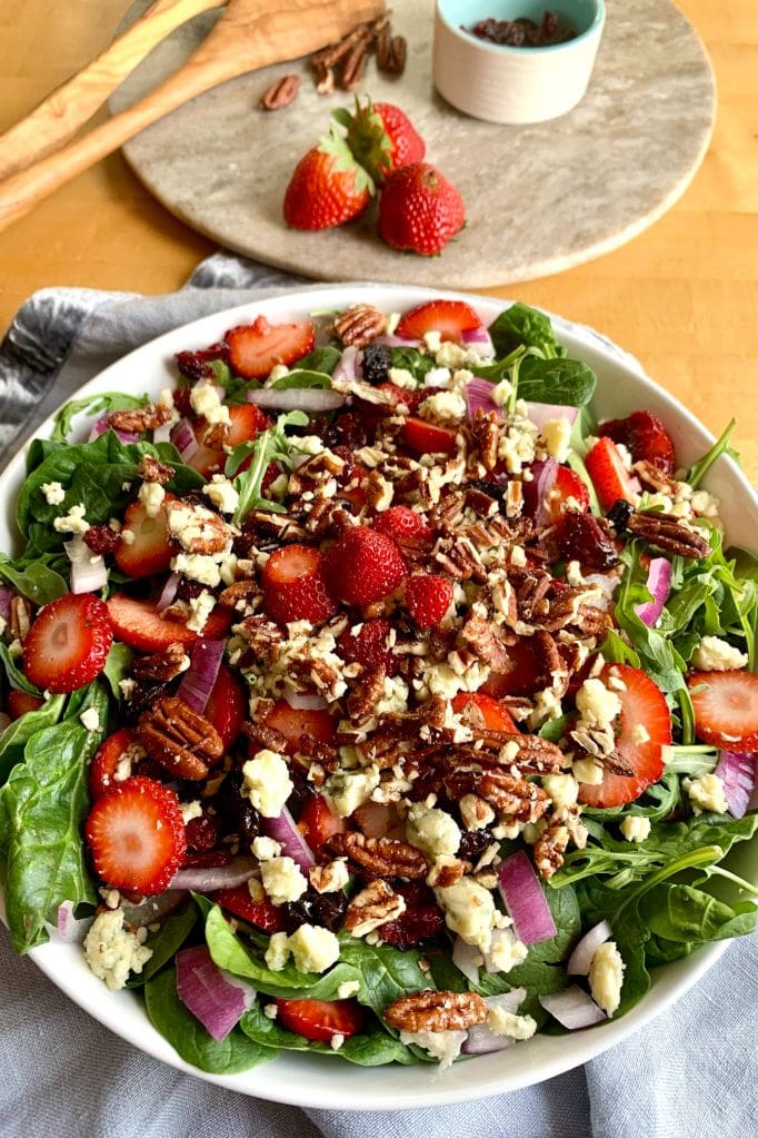 Strawberry Arugula Salad in a serving bowl