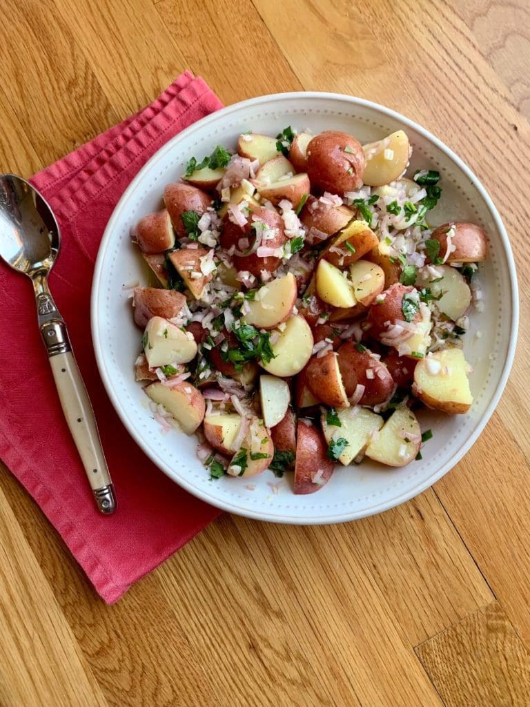Warm potato salad in a bowl