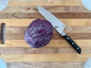 Small red cabbage on a cutting board