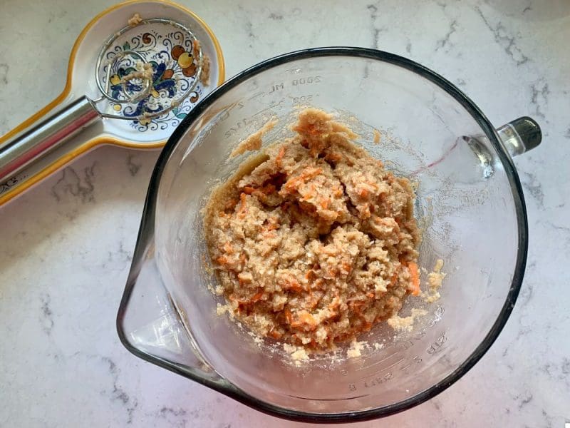 almond flour carrot cake muffin batter in a glass bowl