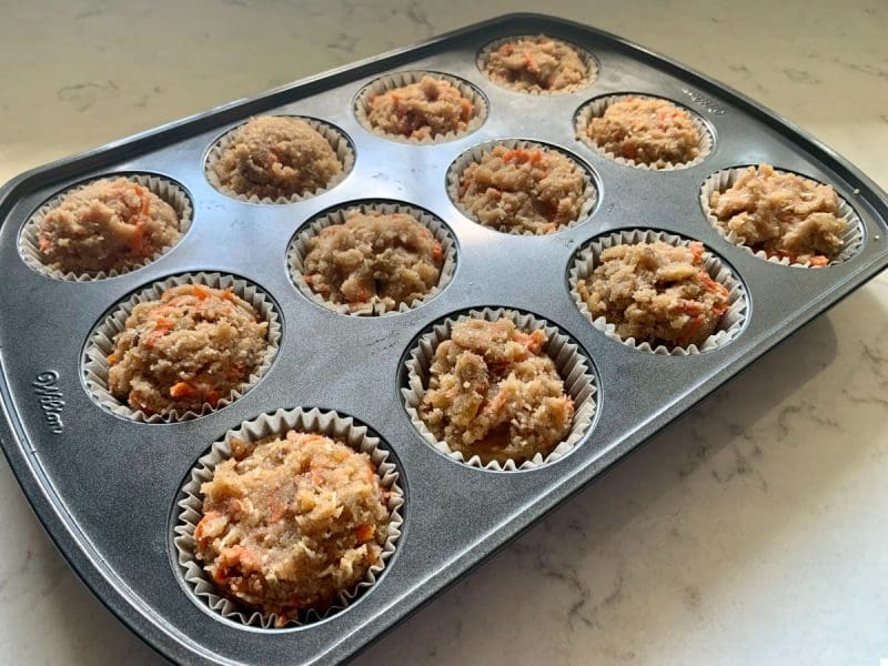 Almond flour carrot cake batter in a muffin pan