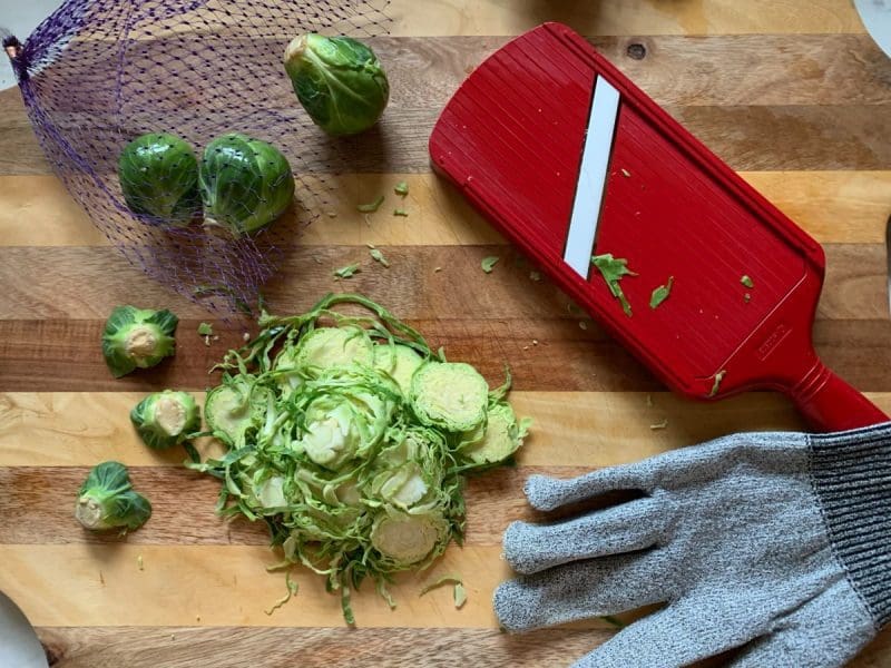 shaved_brussel_sprout_mandoline Shave Brussels sprouts using a mandoline and cut resistent glove