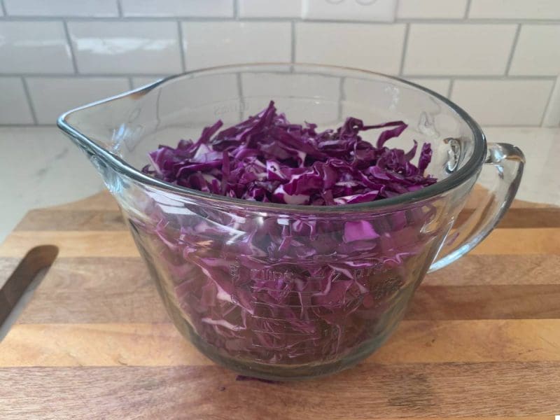 eight cups of red cabbage in a measuring bowl